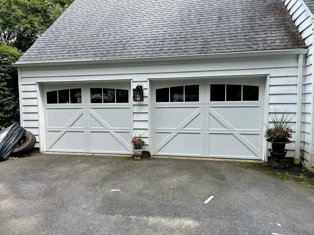 Matching white carriage doors with cross-buck panels
