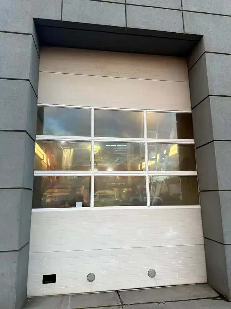 Full-view glass sectional door