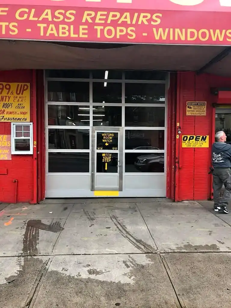 Glass storefront rolling door on a repair shop