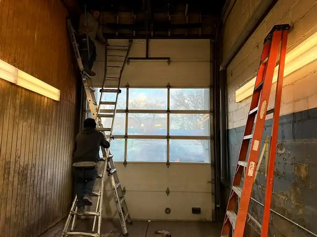 Setting a full-view door from inside the bay