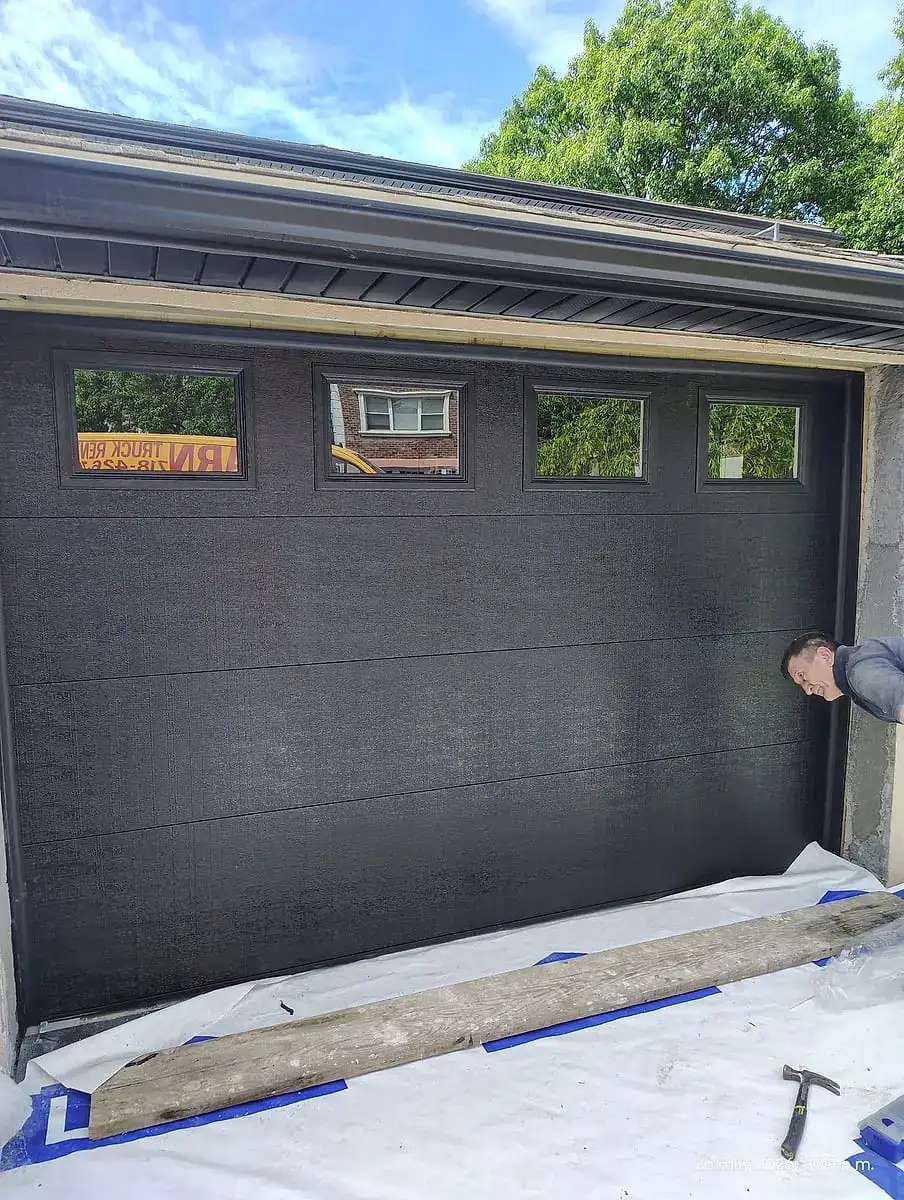 Black door with three top windows, just installed