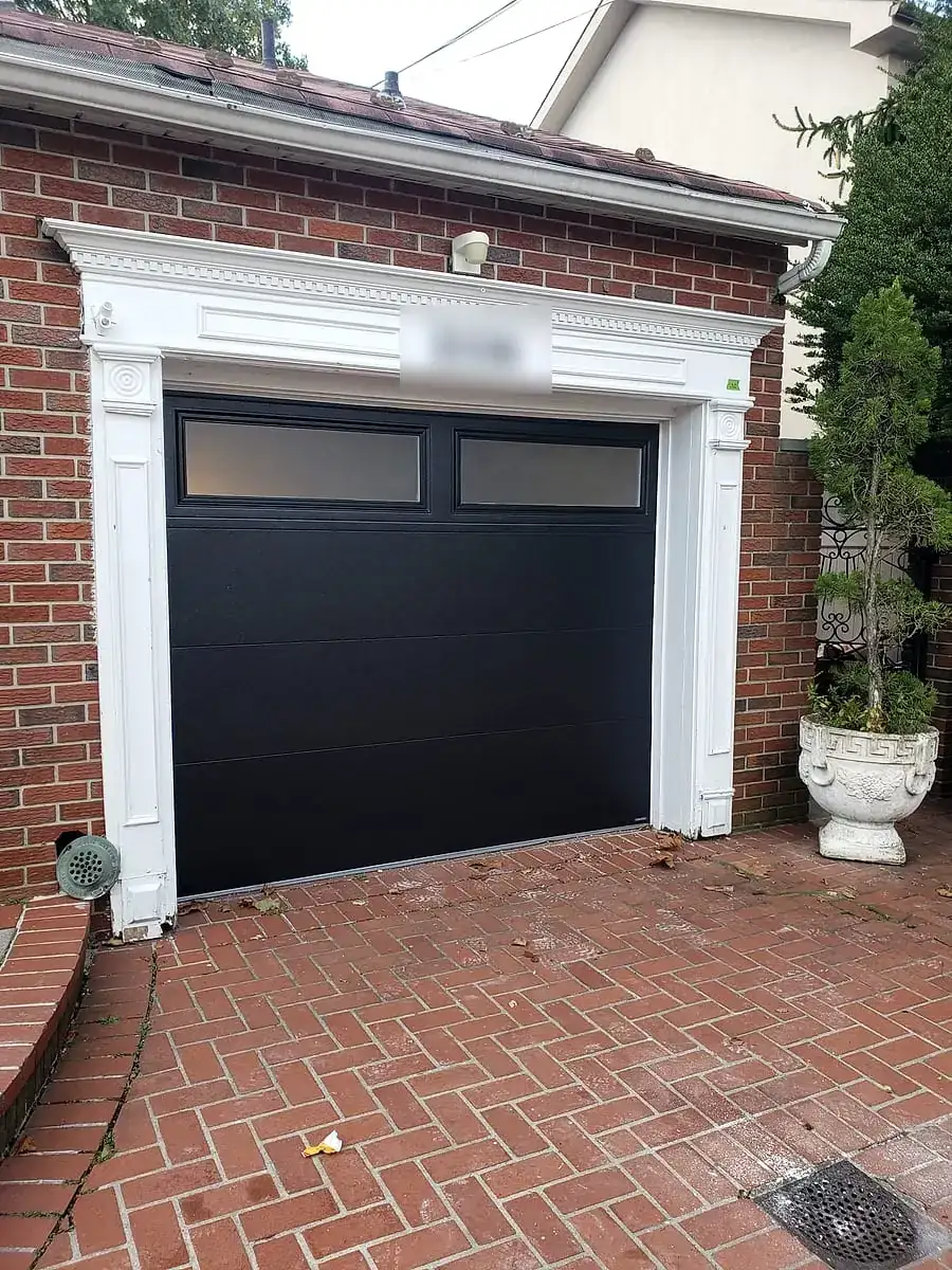 Black flush door with frosted top windows in a white trimmed opening