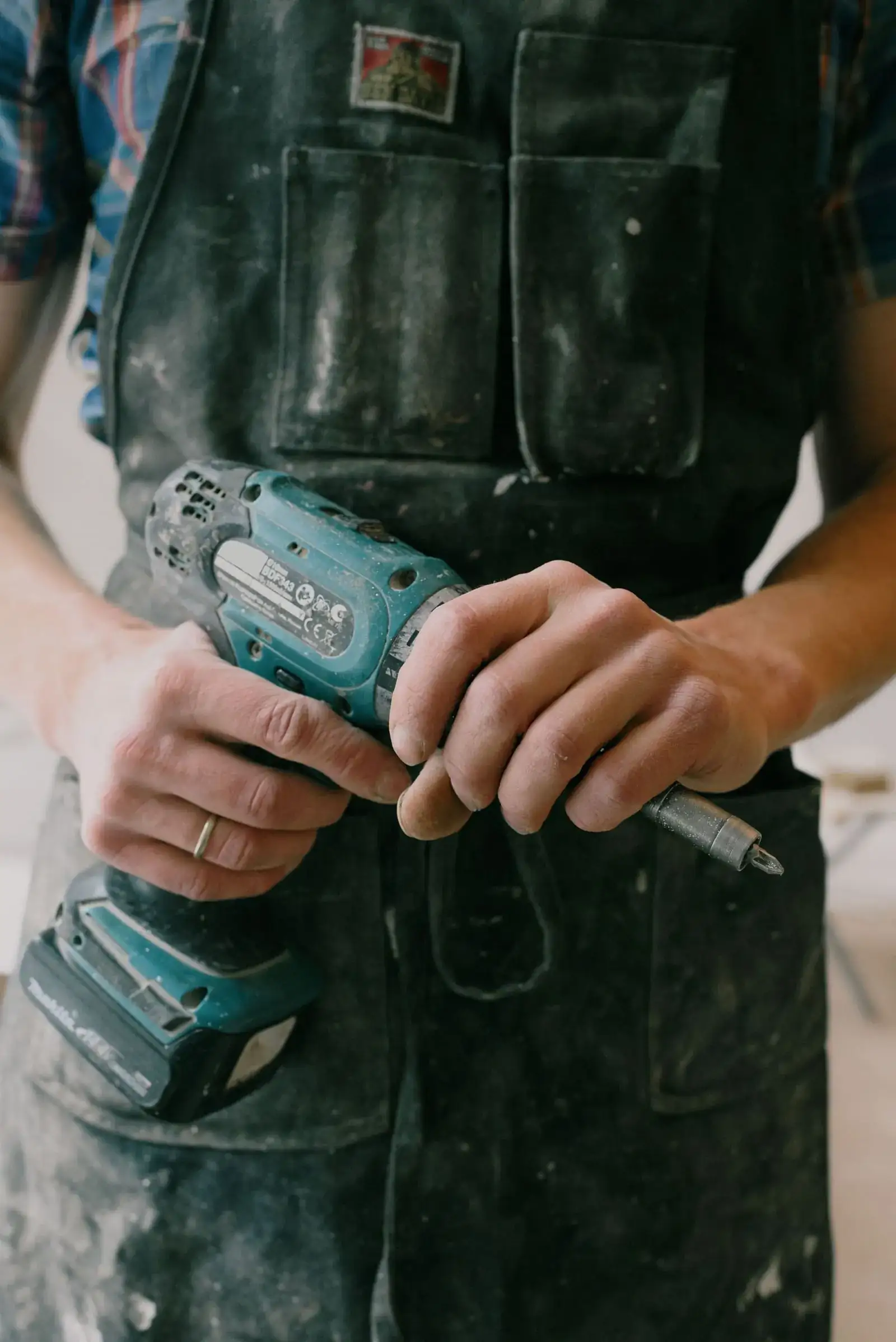 Hands with a drill