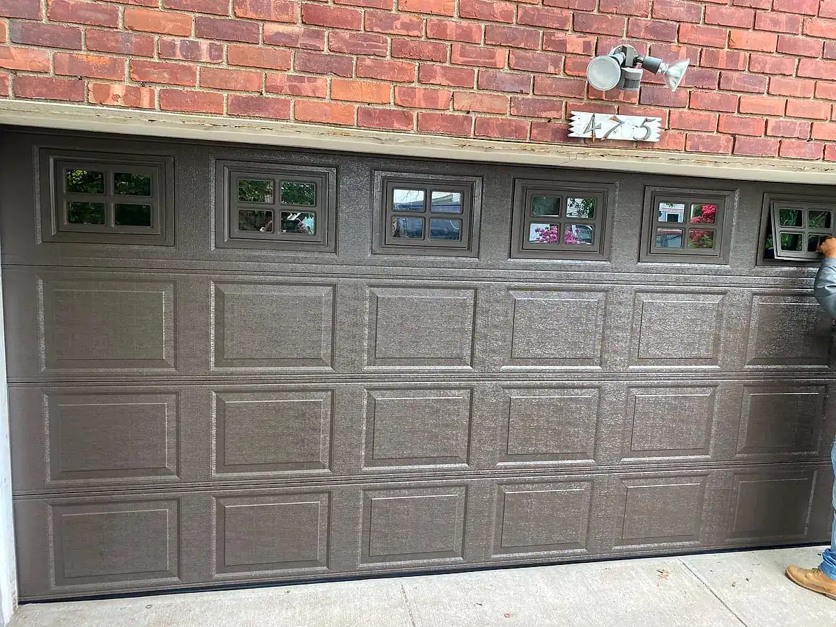 Wood-look long-panel door with a window row on brick